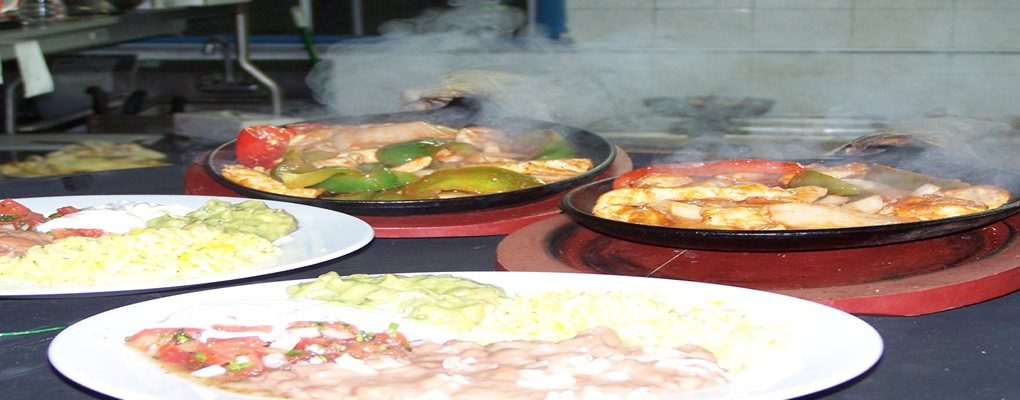 Sizzling Fajitas – Served w/ flour tortillas, guacamole, sour cream, pico de gallo, rice and beans.